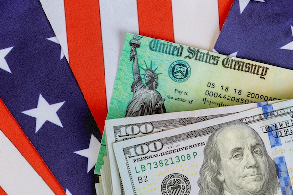 dollar bills on an American flag the new IRS windfall