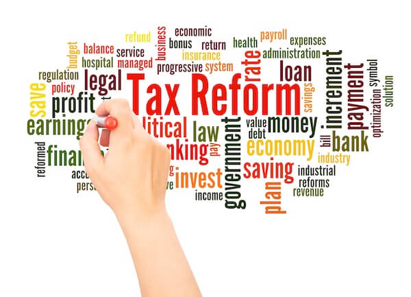 a person writing on a board with a marker 2026 tax updates